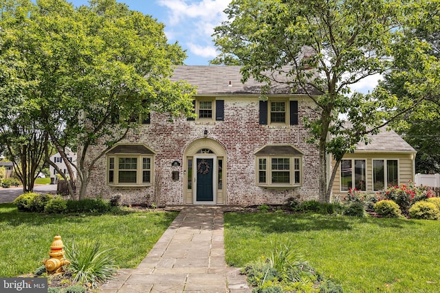 201 S Rd, Wilmington, DE 19809 - view of front of home with a chimney, a front yard, and brick siding