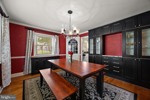 201 S Rd, Wilmington, DE 19809 - dining area with a chandelier, wood finished floors, crown molding, and baseboards