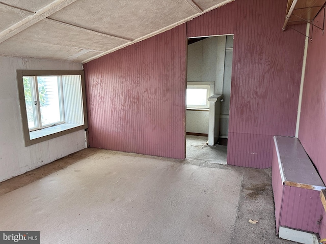 5247 Lincoln Hwy W, Thomasville, PA 17364 - unfurnished room with lofted ceiling, unfinished concrete flooring, and wood walls