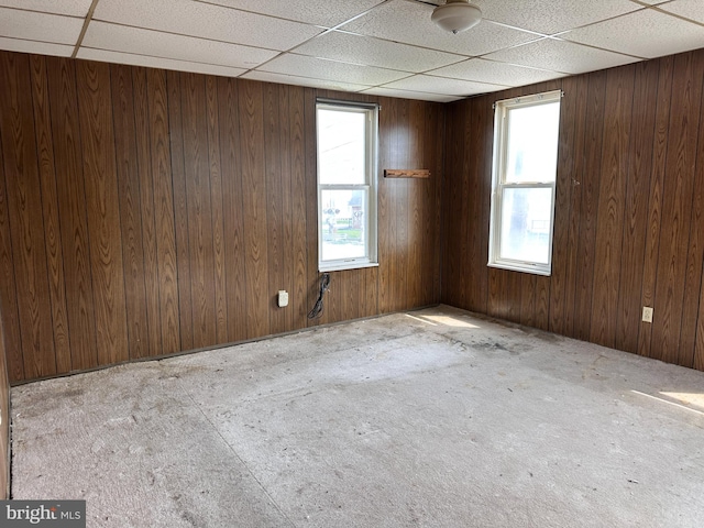 5247 Lincoln Hwy W, Thomasville, PA 17364 - empty room with plenty of natural light, a drop ceiling, and wooden walls