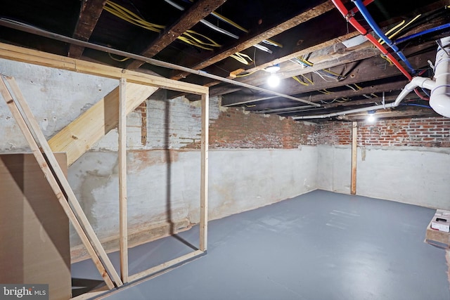 565 Line St, Camden, NJ 08103 - unfinished below grade area with brick wall