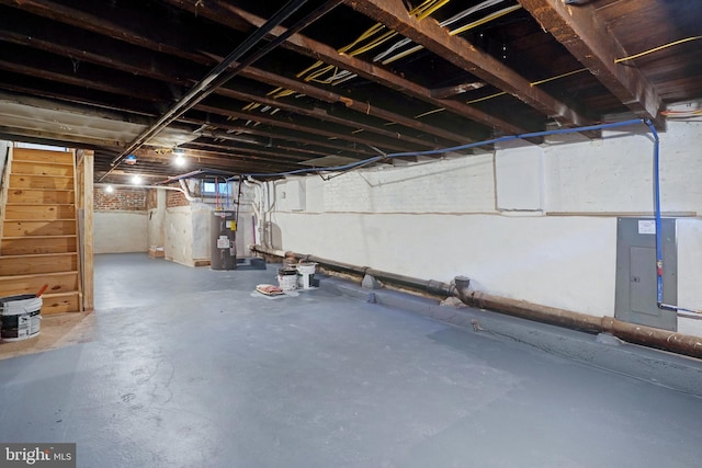 565 Line St, Camden, NJ 08103 - basement featuring water heater, stairs, and electric panel