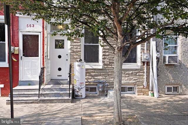 565 Line St, Camden, NJ 08103 - view of exterior entry with water heater and stone siding