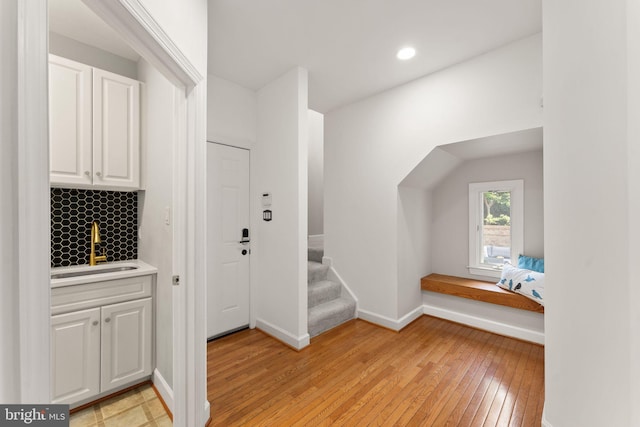 22962 Lois Ln, Brambleton, VA 20148 - foyer entrance featuring light wood-type flooring, baseboards, stairs, and recessed lighting