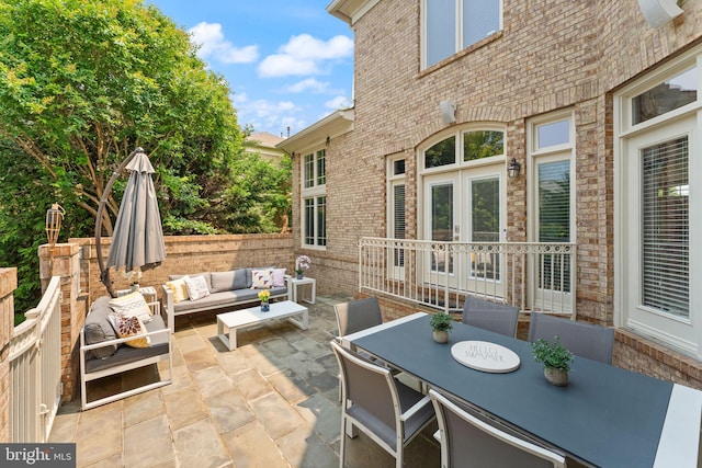 22962 Lois Ln, Brambleton, VA 20148 - view of patio featuring outdoor lounge area, french doors, and outdoor dining space