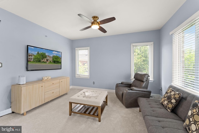 22962 Lois Ln, Brambleton, VA 20148 - living room with a ceiling fan, light colored carpet, and baseboards