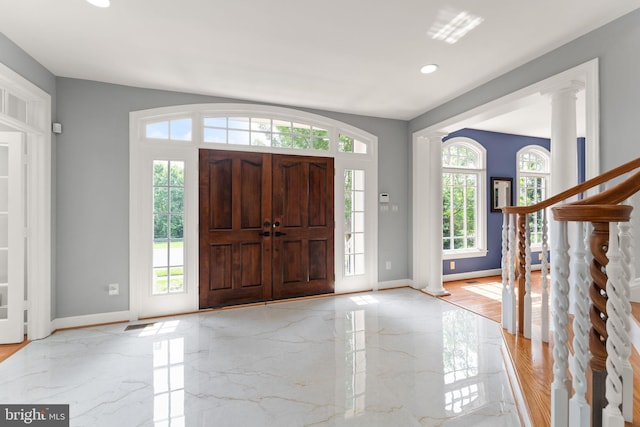 22962 Lois Ln, Brambleton, VA 20148 - entryway with healthy amount of natural light, baseboards, light marble finish floors, and recessed lighting