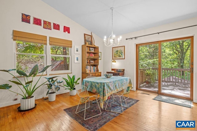 213 Turkey Ridge Rd, Charlottesville, VA 22903 - dining area featuring hardwood / wood-style floors, a chandelier, healthy amount of natural light, vaulted ceiling, and baseboards
