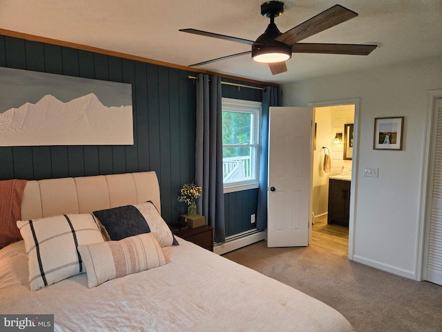 1222 Pinehurst Rd, Staunton, VA 24401 - bedroom featuring baseboard heating, carpet, baseboards, ensuite bathroom, and wood walls