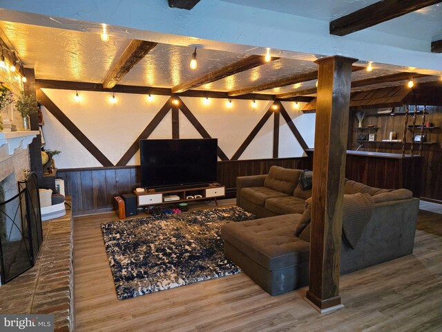 1222 Pinehurst Rd, Staunton, VA 24401 - living area with wood finished floors, wood walls, wainscoting, beamed ceiling, and a fireplace