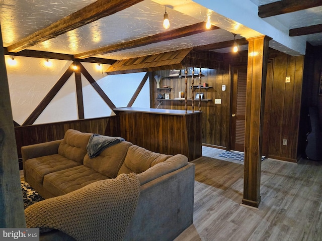 1222 Pinehurst Rd, Staunton, VA 24401 - living room featuring wood walls, beamed ceiling, wood finished floors, and bar area