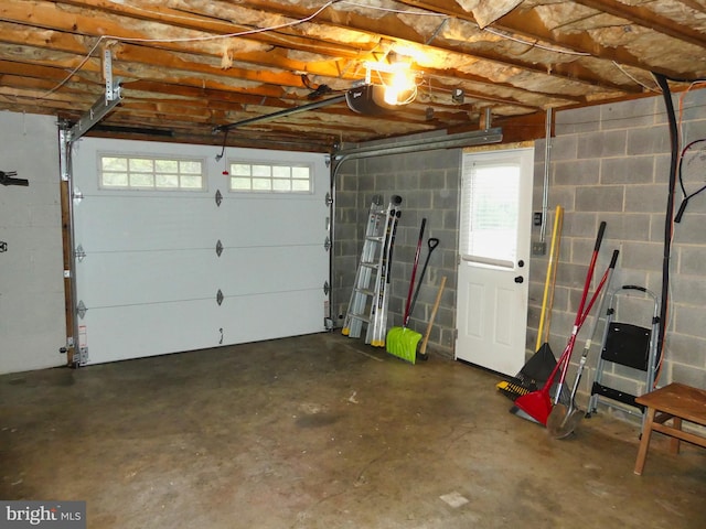 1222 Pinehurst Rd, Staunton, VA 24401 - garage featuring a garage door opener and concrete block wall