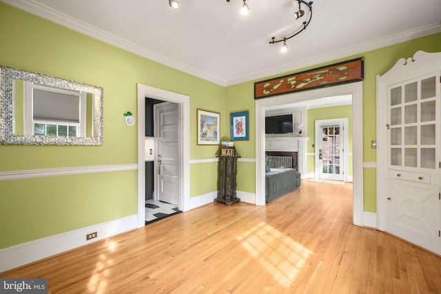 1107 Kenmore Ave, Fredericksburg, VA 22401 - spare room featuring wood finished floors, baseboards, a fireplace, and ornamental molding