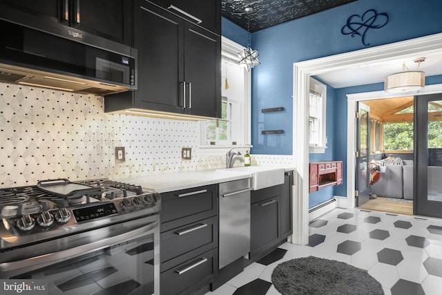 1107 Kenmore Ave, Fredericksburg, VA 22401 - kitchen featuring appliances with stainless steel finishes, a sink, plenty of natural light, and light countertops