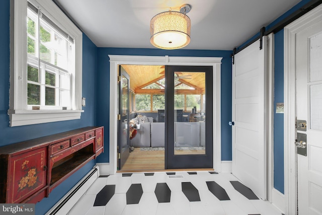 1107 Kenmore Ave, Fredericksburg, VA 22401 - doorway featuring a barn door, healthy amount of natural light, tile patterned floors, and baseboards