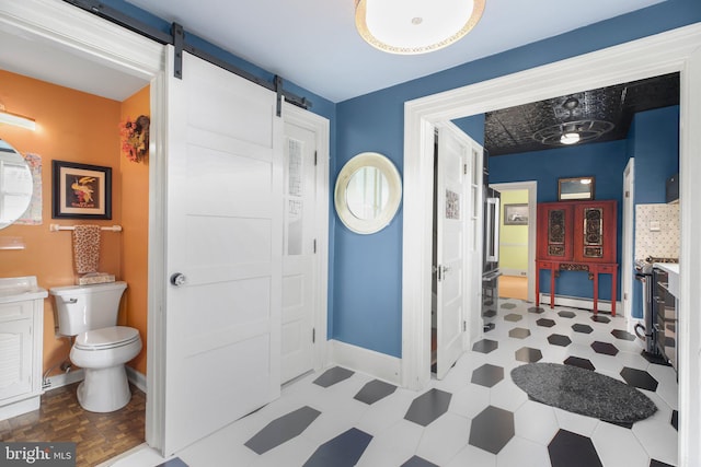 1107 Kenmore Ave, Fredericksburg, VA 22401 - bathroom with toilet, vanity, tile patterned floors, and baseboards