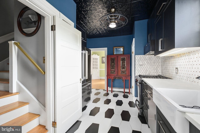 1107 Kenmore Ave, Fredericksburg, VA 22401 - washroom with light floors, a baseboard heating unit, an ornate ceiling, a sink, and a workshop area