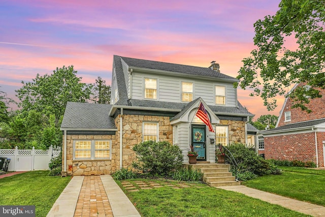 1107 Kenmore Ave, Fredericksburg, VA 22401 - view of front of property featuring stone siding, a chimney, and roof with shingles