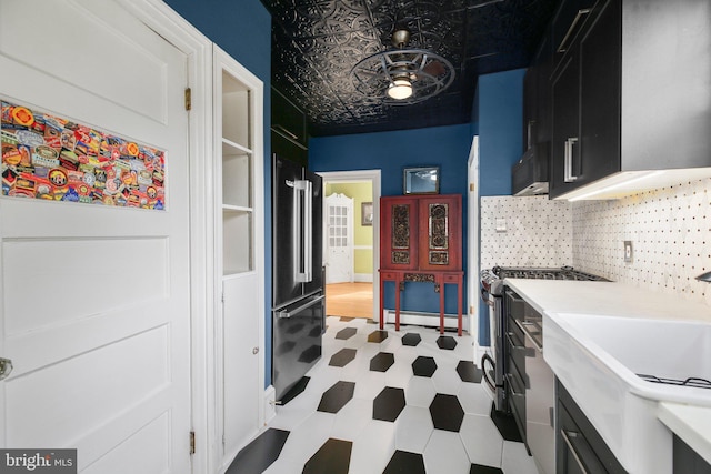 1107 Kenmore Ave, Fredericksburg, VA 22401 - laundry room with tile patterned floors, a baseboard heating unit, and a sink