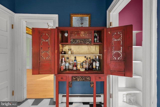 1107 Kenmore Ave, Fredericksburg, VA 22401 - indoor dry bar with a baseboard radiator and tile patterned floors