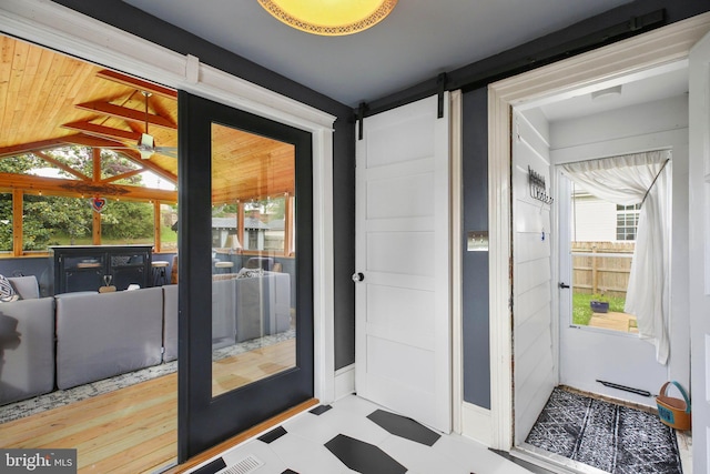 1107 Kenmore Ave, Fredericksburg, VA 22401 - entryway with vaulted ceiling, tile patterned floors, and a barn door