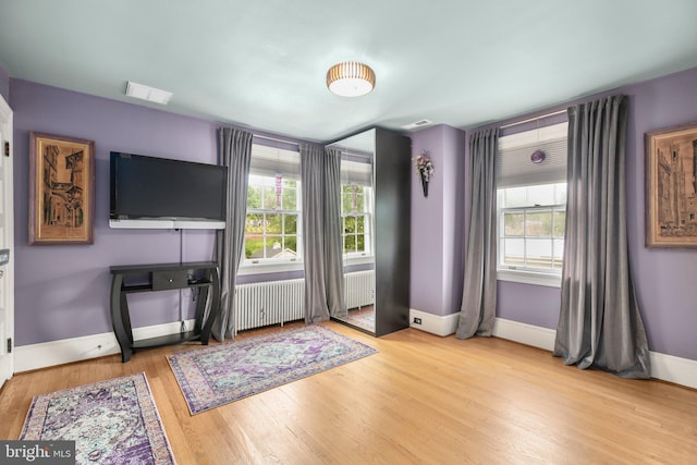 1107 Kenmore Ave, Fredericksburg, VA 22401 - living room with plenty of natural light, wood finished floors, and radiator heating unit