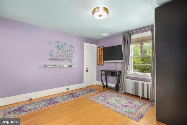 1107 Kenmore Ave, Fredericksburg, VA 22401 - bedroom featuring radiator, wood finished floors, and baseboards