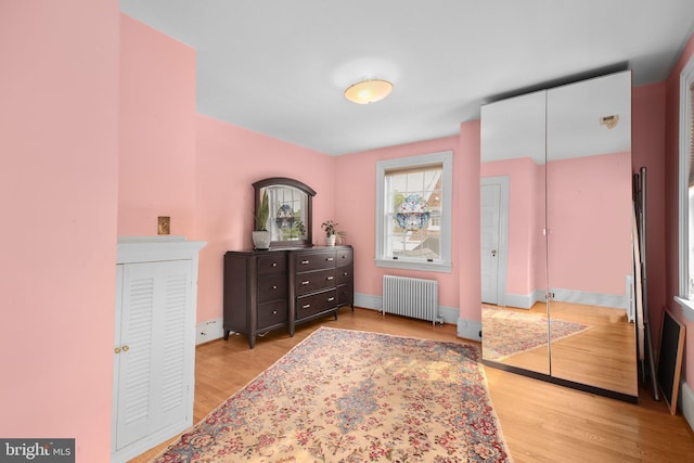 1107 Kenmore Ave, Fredericksburg, VA 22401 - bedroom with radiator heating unit, wood finished floors, and baseboards