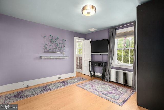1107 Kenmore Ave, Fredericksburg, VA 22401 - bedroom with radiator, wood finished floors, and baseboards