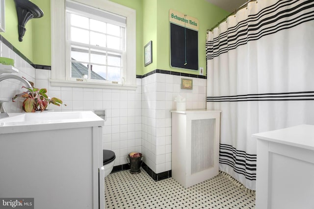 1107 Kenmore Ave, Fredericksburg, VA 22401 - full bathroom with tile walls, wainscoting, toilet, tile patterned floors, and vanity