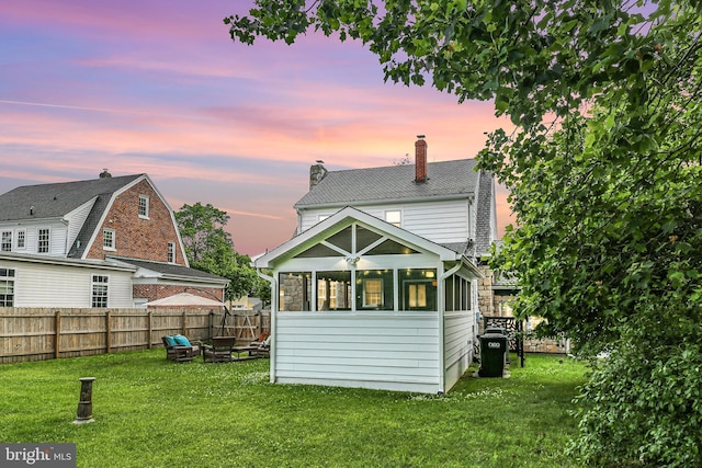 1107 Kenmore Ave, Fredericksburg, VA 22401 - back of property with a chimney and a sunroom