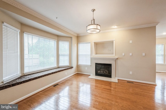 3416 Barnhouse Dr, Edgewater, MD 21037 - unfurnished living room with ornamental molding, wood finished floors, baseboards, and a fireplace