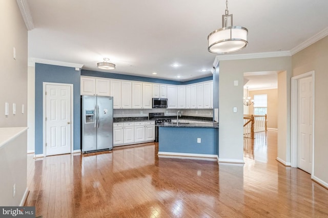 3416 Barnhouse Dr, Edgewater, MD 21037 - kitchen with stainless steel appliances, dark countertops, ornamental molding, light wood-type flooring, and white cabinets