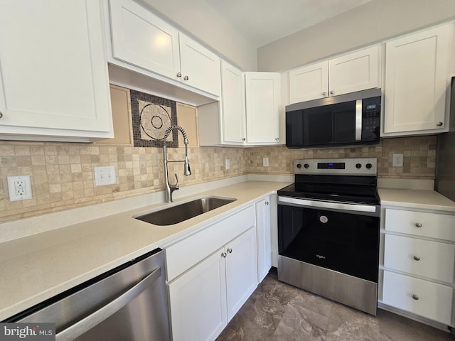 1248 Steed St, Ranson, WV 25438 - kitchen with appliances with stainless steel finishes, a sink, white cabinetry, and tasteful backsplash