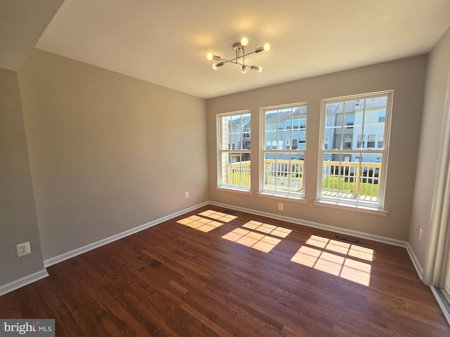 1248 Steed St, Ranson, WV 25438 - unfurnished dining area with wood finished floors, healthy amount of natural light, baseboards, and a chandelier