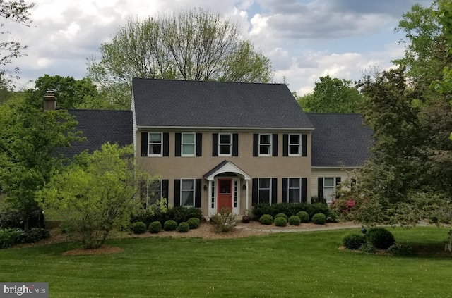 11 White Oak Dr, West Grove, PA 19390 - colonial house with a front lawn, a shingled roof, and stucco siding