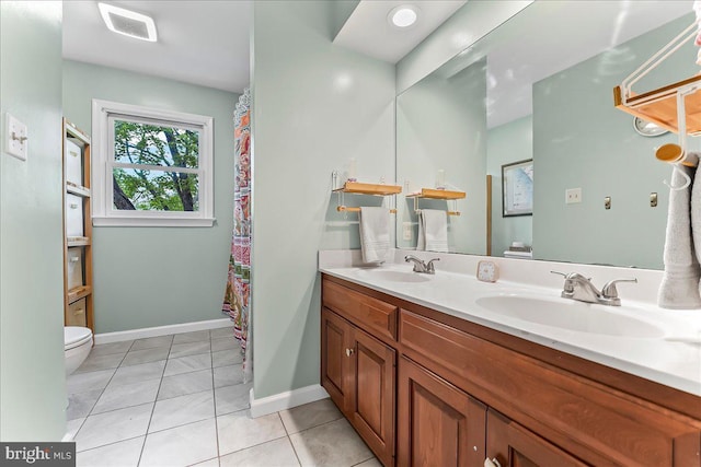 11 White Oak Dr, West Grove, PA 19390 - full bath featuring toilet, double vanity, tile patterned floors, and baseboards