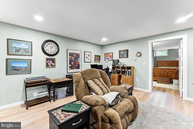 11 White Oak Dr, West Grove, PA 19390 - living room featuring light wood-style flooring, baseboards, recessed lighting, a desk, and a baseboard heating unit
