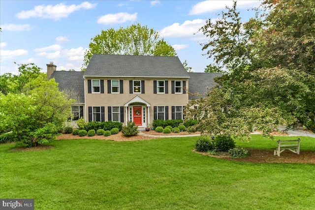 11 White Oak Dr, West Grove, PA 19390 - colonial inspired home with a front lawn, a chimney, and a shingled roof