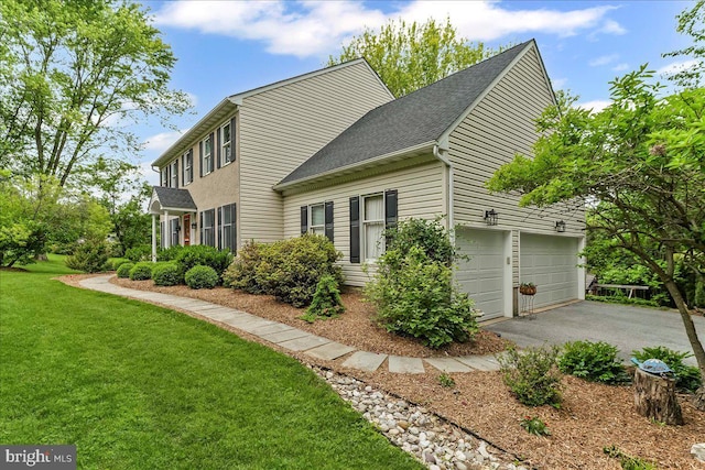 11 White Oak Dr, West Grove, PA 19390 - view of side of home with a lawn, driveway, roof with shingles, and a garage