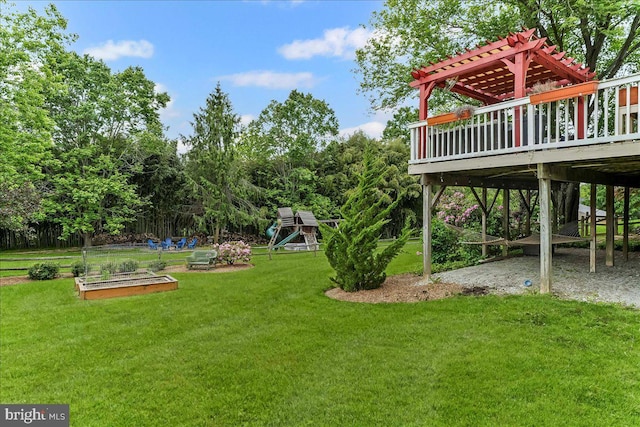 11 White Oak Dr, West Grove, PA 19390 - view of green lawn with a playground, a vegetable garden, a pergola, and a deck