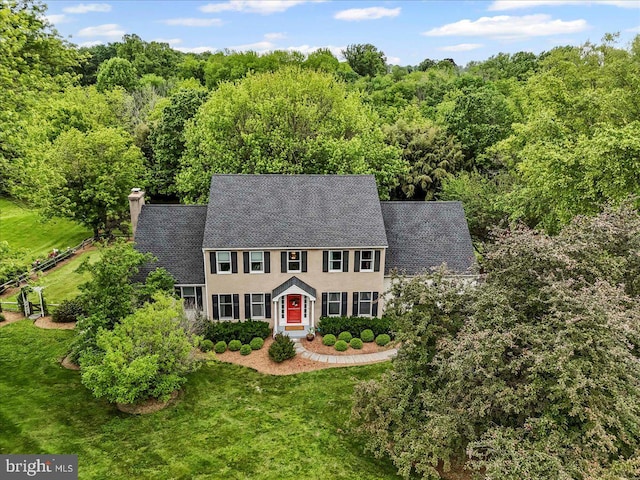 11 White Oak Dr, West Grove, PA 19390 - colonial home with a chimney, a shingled roof, and a front yard