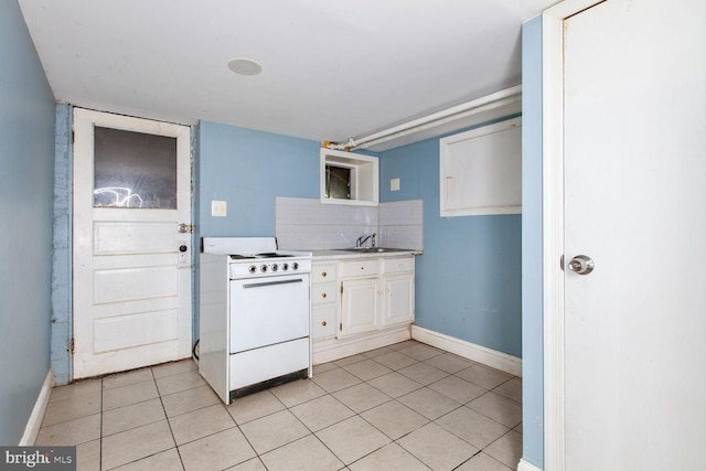 6745 Woodley, Dundalk, MD 21222 - kitchen with white stove, decorative backsplash, baseboards, and light countertops