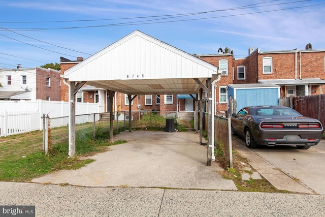 6745 Woodley, Dundalk, MD 21222 - view of front of home featuring a carport, driveway, and brick siding
