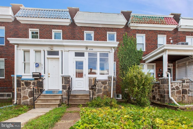 6745 Woodley, Dundalk, MD 21222 - view of property featuring a tile roof and brick siding
