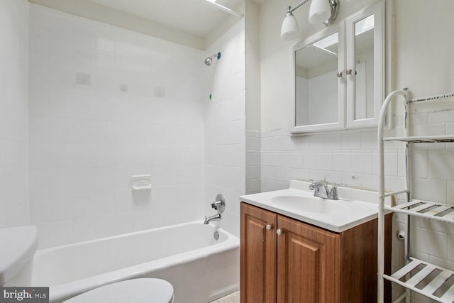 6745 Woodley, Dundalk, MD 21222 - full bathroom featuring toilet, vanity, tile walls, and shower / bathtub combination