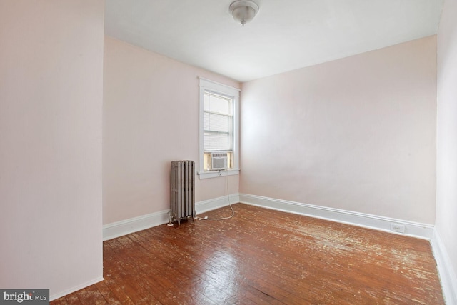 6745 Woodley, Dundalk, MD 21222 - unfurnished room with radiator, wood-type flooring, baseboards, and cooling unit