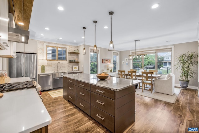 729 Highgate Row, Crozet, VA 22932 - kitchen with appliances with stainless steel finishes, white cabinets, dark brown cabinetry, backsplash, and a sink