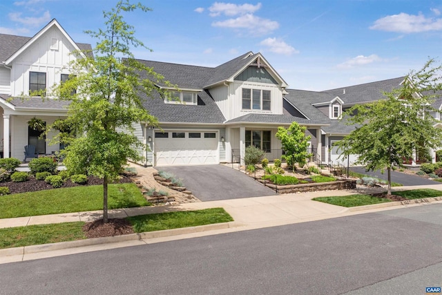 729 Highgate Row, Crozet, VA 22932 - view of front facade featuring board and batten siding, asphalt driveway, and a garage