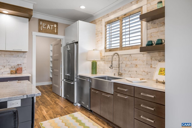729 Highgate Row, Crozet, VA 22932 - kitchen with appliances with stainless steel finishes, a sink, open shelves, decorative backsplash, and ornamental molding